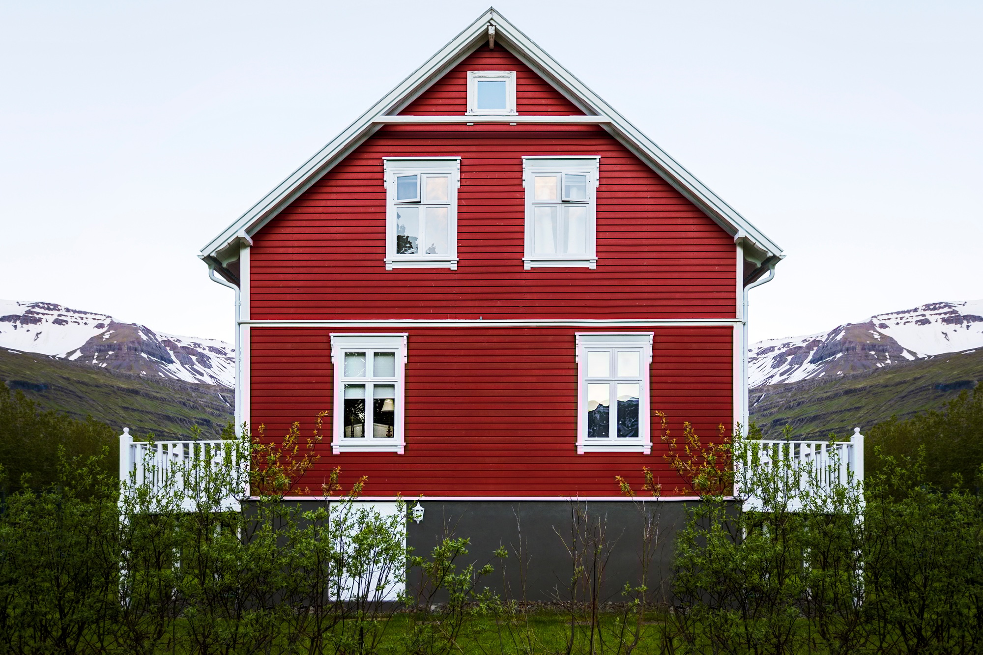 Beautiful facade of a wooden red house